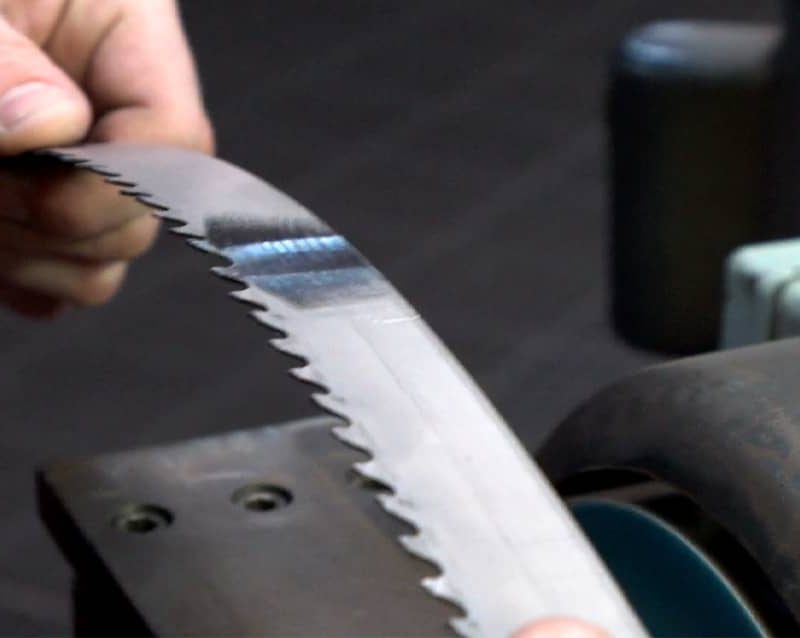 Bandsaw blade in hand close view